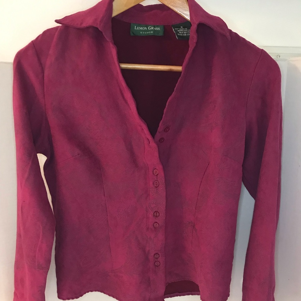 Women’s pink button down blouse.